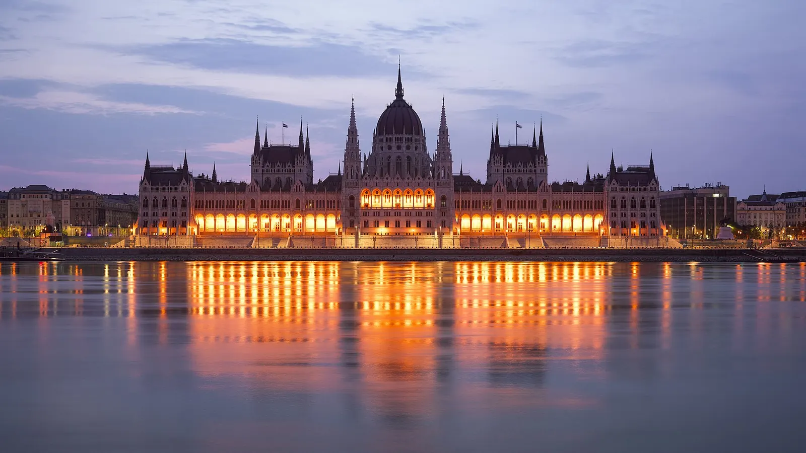 The Hungarian Parliament reflected in the Danube at dusk