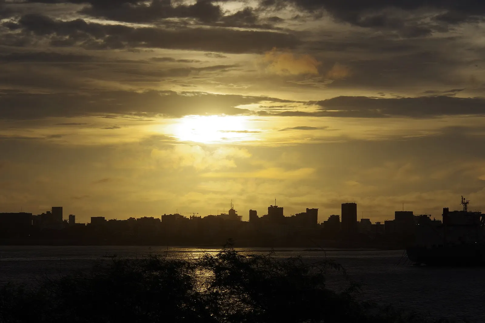 The sun setting over the Dakar skyline, seen from Gorée Island