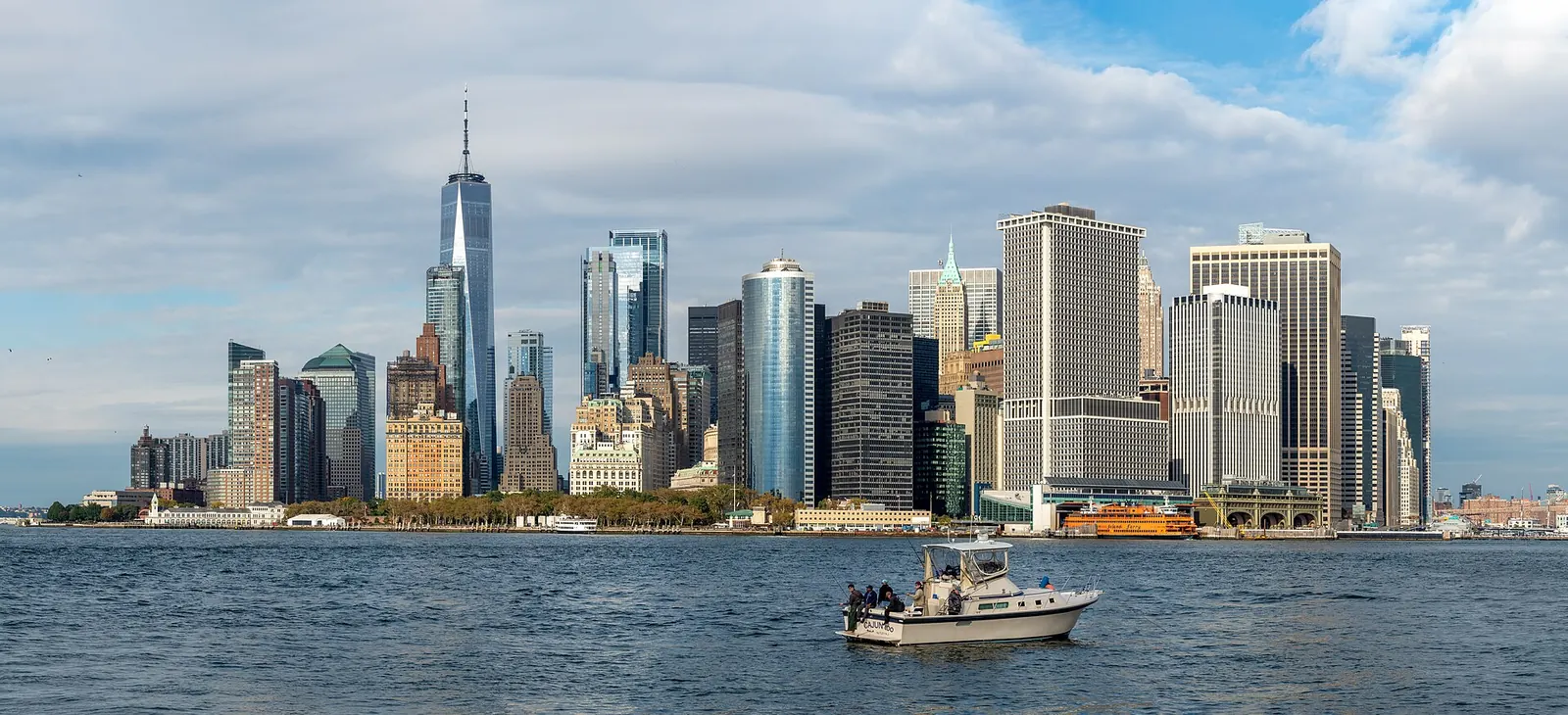 The Lower Manhattan skyline seen across the water on a sunny day